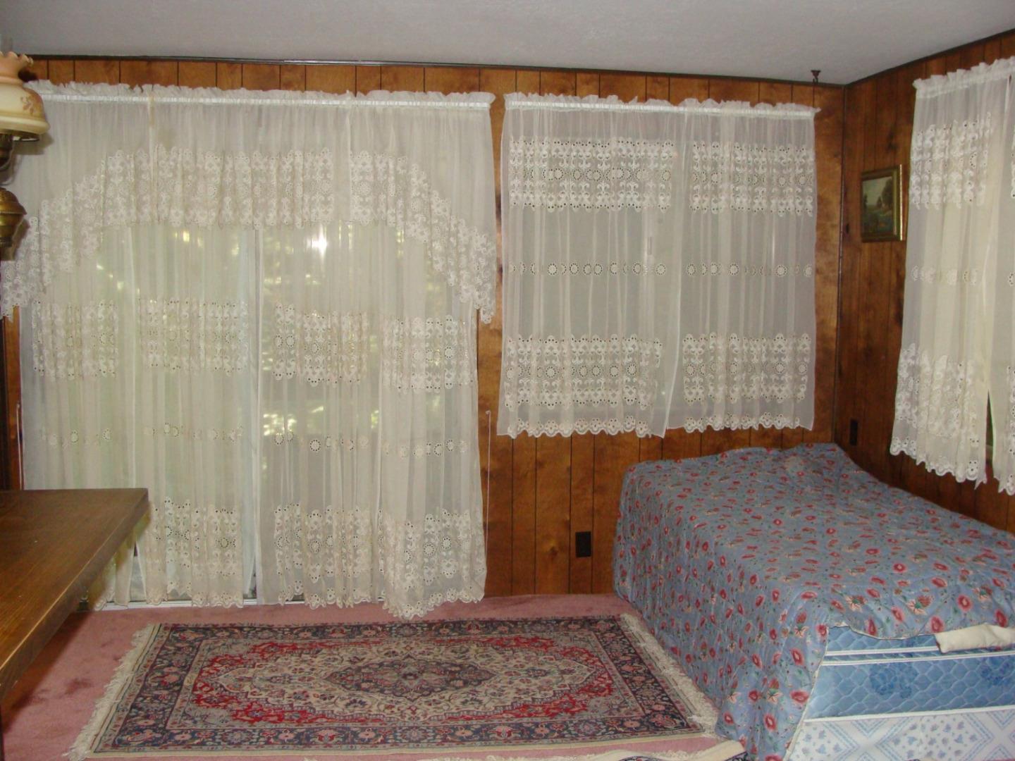 7150 Croy Road Morgan Hill, CA 95037 - Photo 34 of 67 a bedroom with a bed and a window