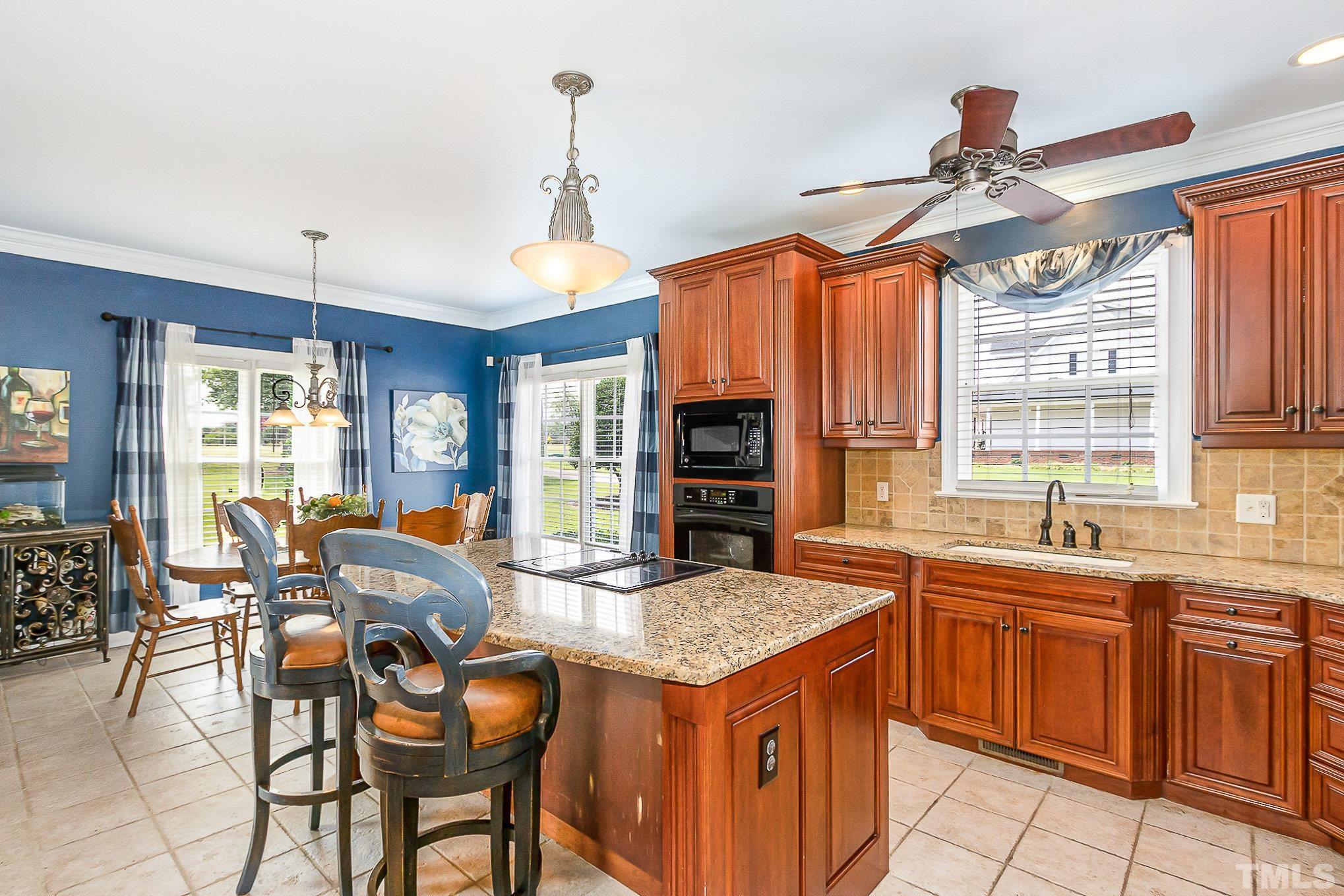 3733 Johnson Pond Road Raleigh, NC 27603 - Photo 13 of 41 a kitchen with a stove a sink dishwasher and a microwave