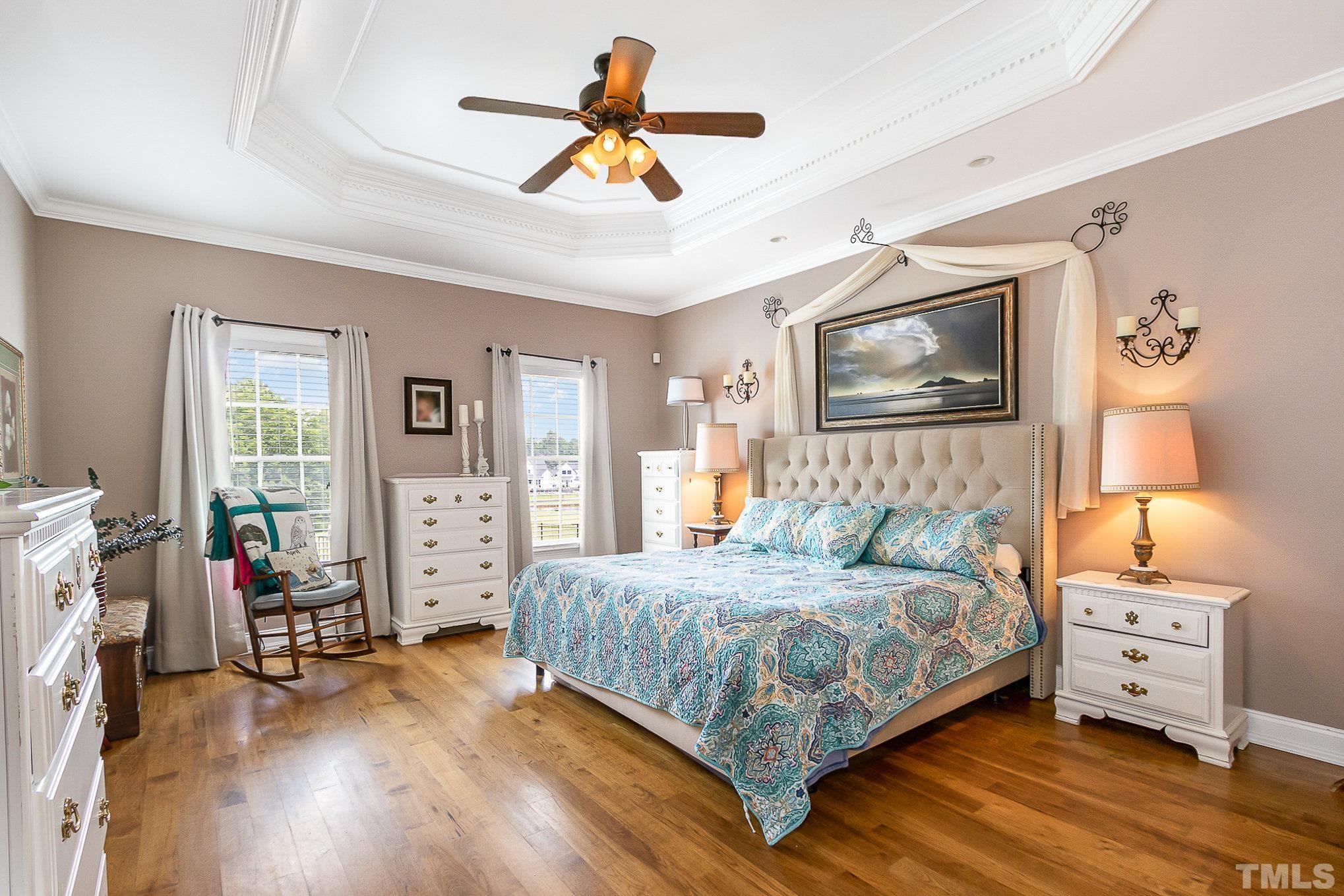 3733 Johnson Pond Road Raleigh, NC 27603 - Photo 17 of 41 a bedroom with a bed a flat screen tv and dresser