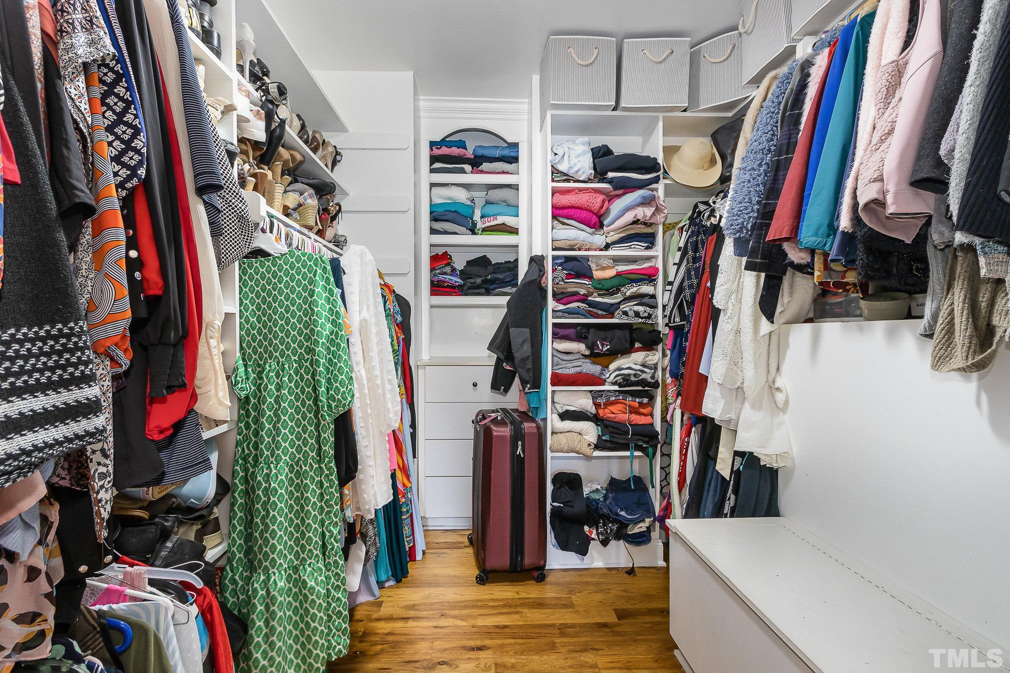 3733 Johnson Pond Road Raleigh, NC 27603 - Photo 22 of 41 a view of walk in closet with clothes and shoes