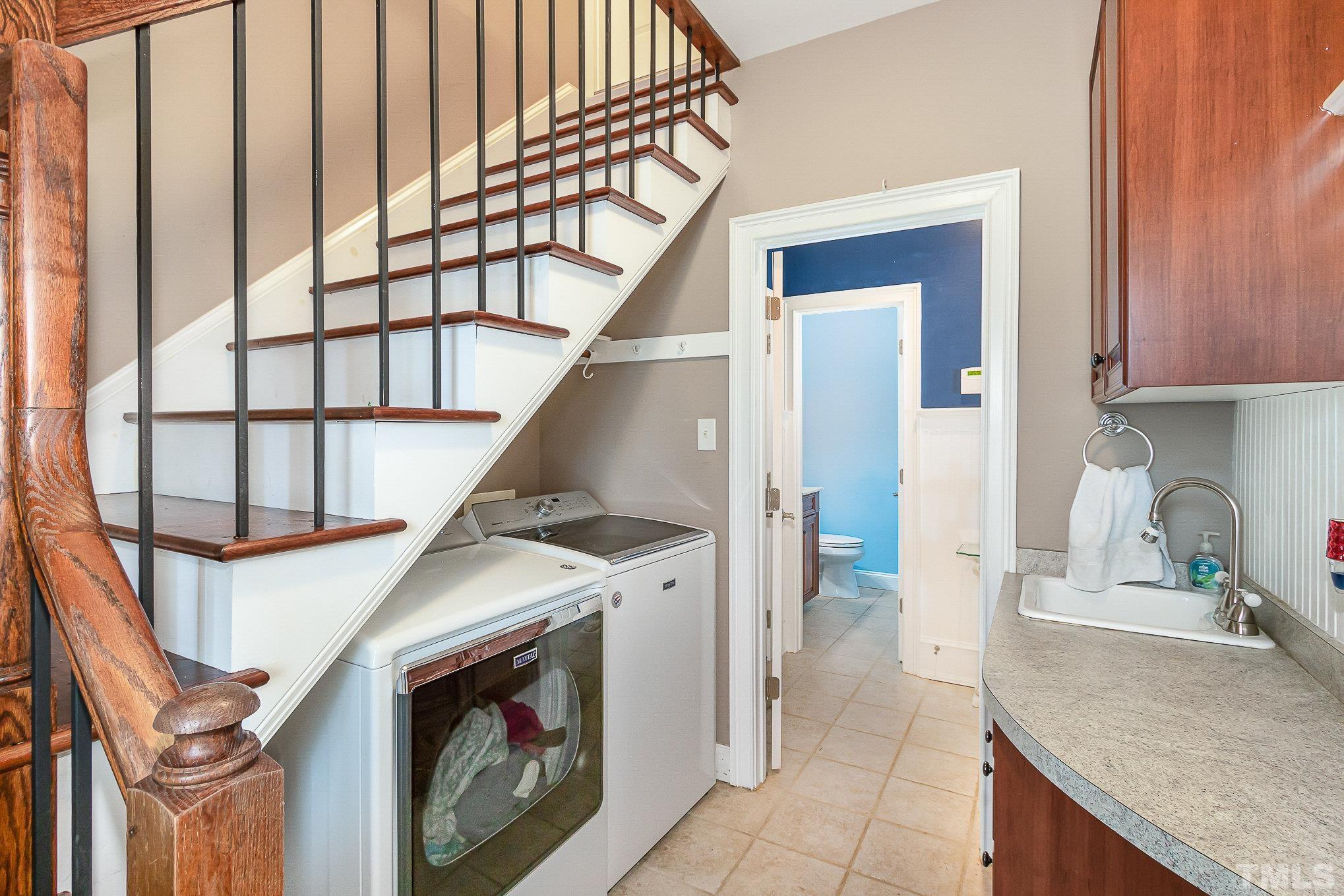 3733 Johnson Pond Road Raleigh, NC 27603 - Photo 26 of 41 a kitchen with a sink and a stove top oven with granite countertops