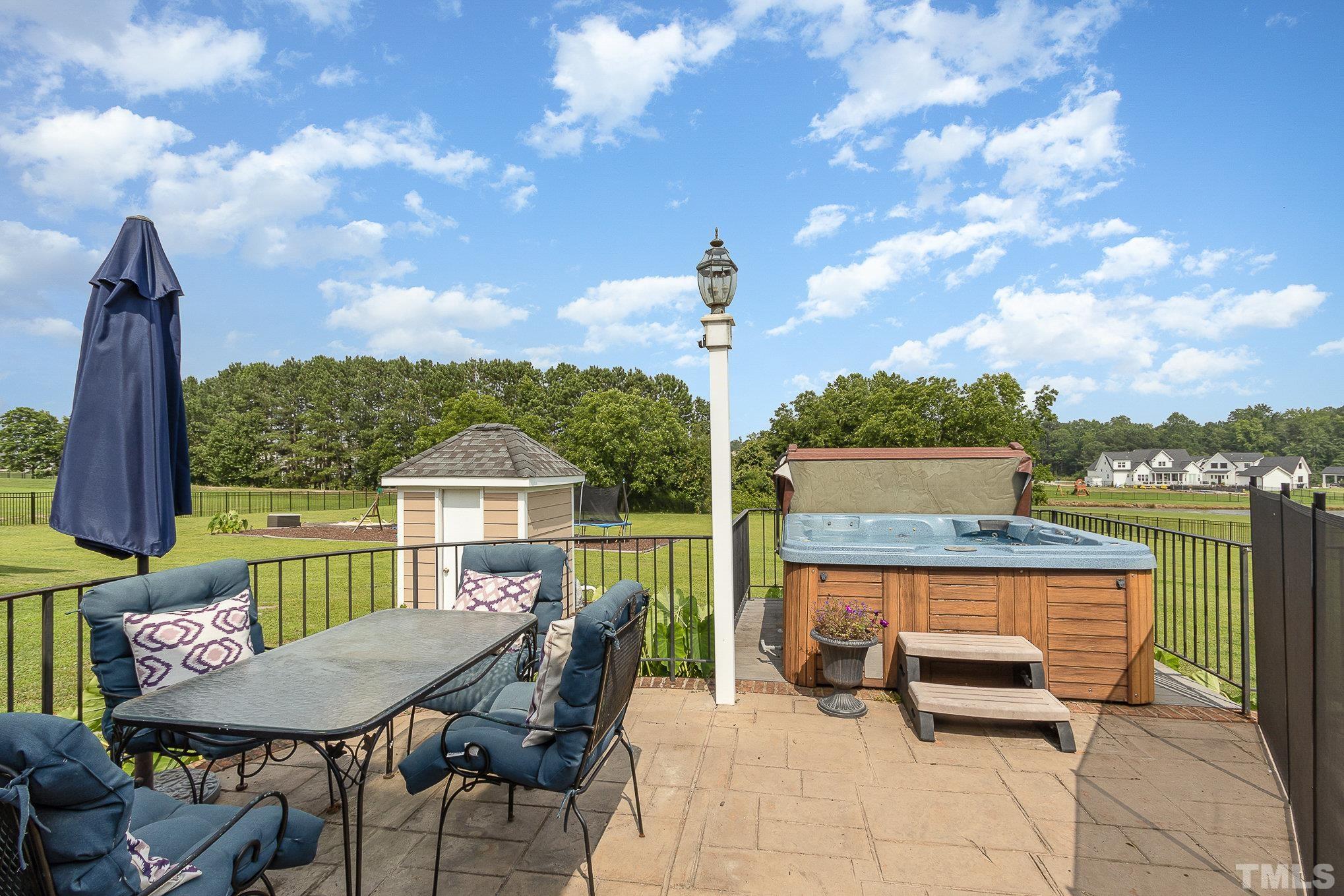 3733 Johnson Pond Road Raleigh, NC 27603 - Photo 28 of 41 a roof deck with table and chairs and potted plants