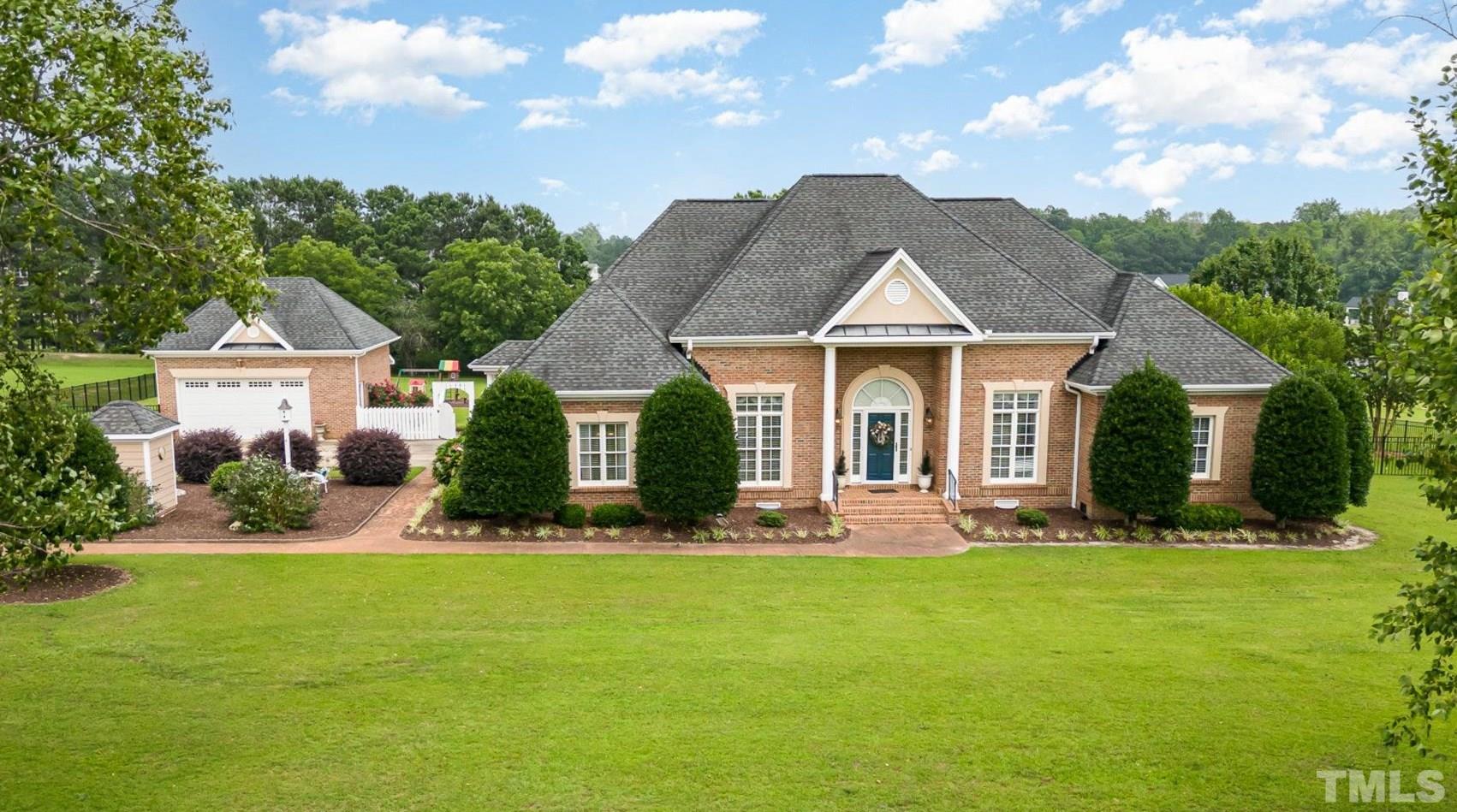 3733 Johnson Pond Road Raleigh, NC 27603 - Photo 3 of 41 a front view of a house with a yard