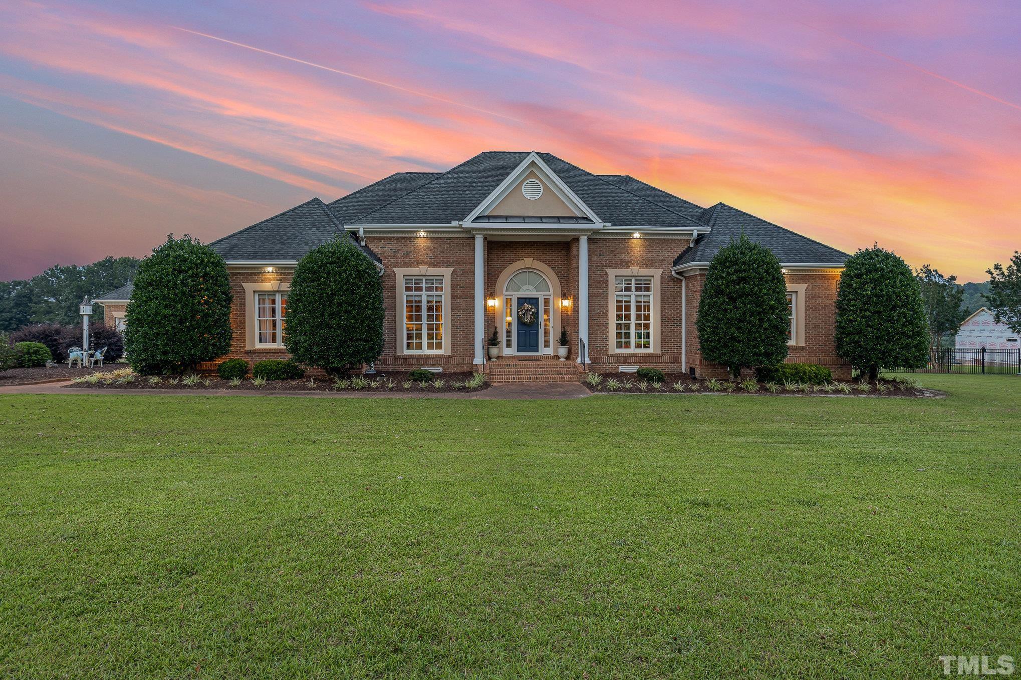 3733 Johnson Pond Road Raleigh, NC 27603 - Photo 39 of 41 a front view of a house with a garden