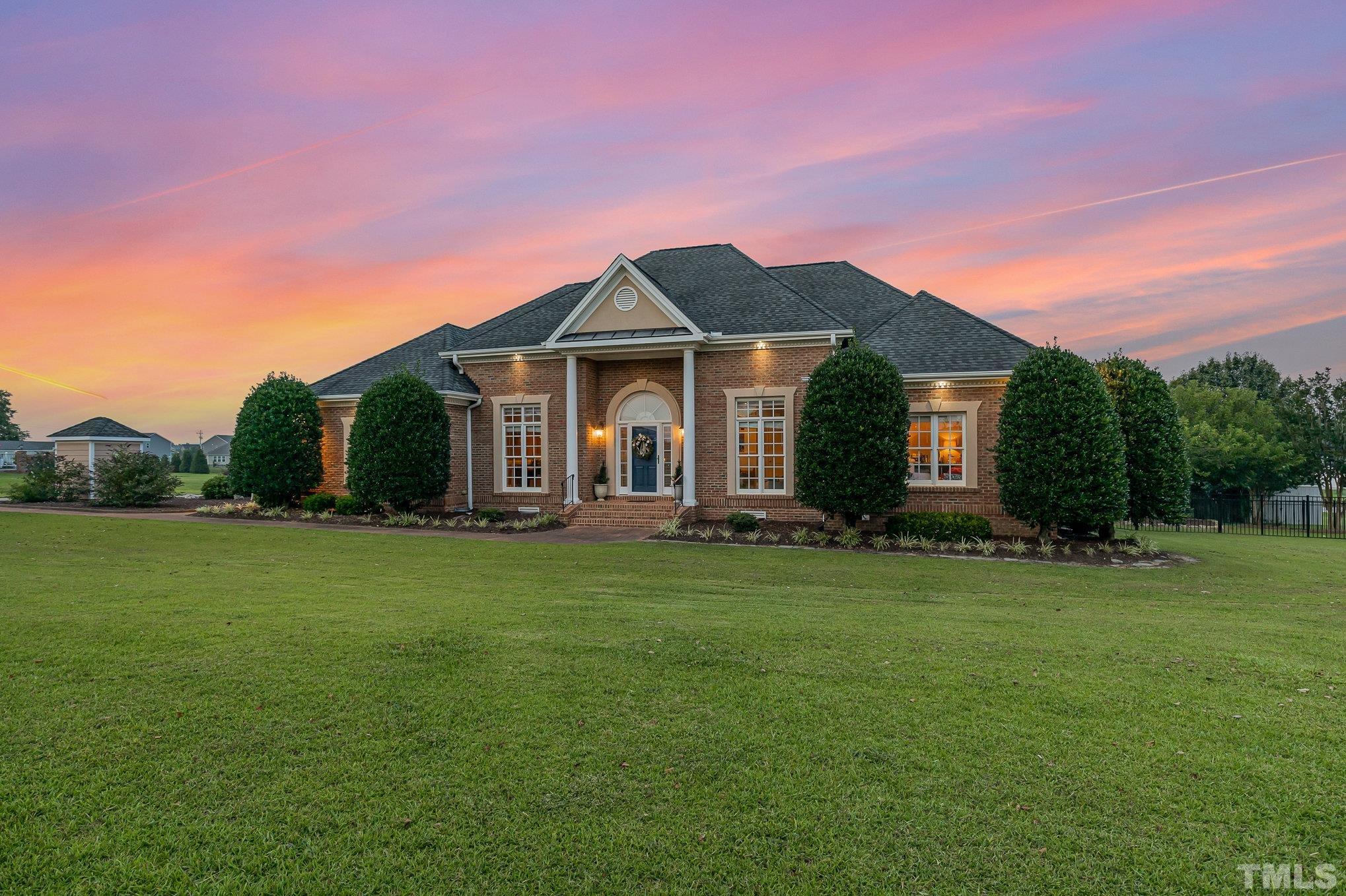 3733 Johnson Pond Road Raleigh, NC 27603 - Photo 40 of 41 a front view of a house with a garden
