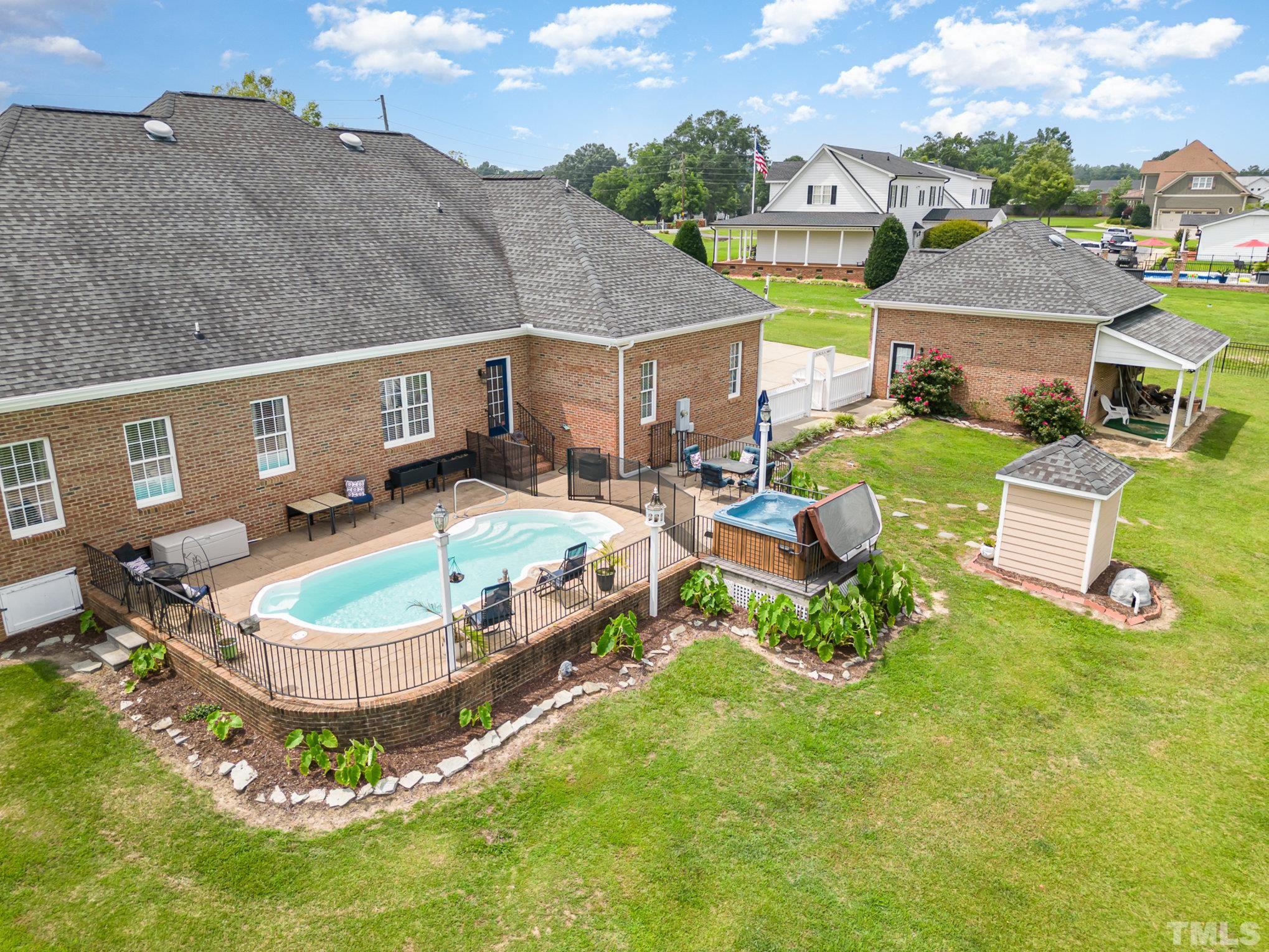 3733 Johnson Pond Road Raleigh, NC 27603 - Photo 4 of 41 a view of a house with pool and chairs