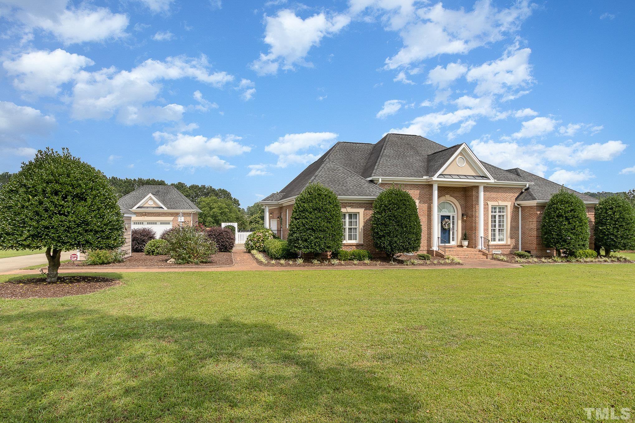 3733 Johnson Pond Road Raleigh, NC 27603 - Photo 41 of 41 a front view of a house with a garden