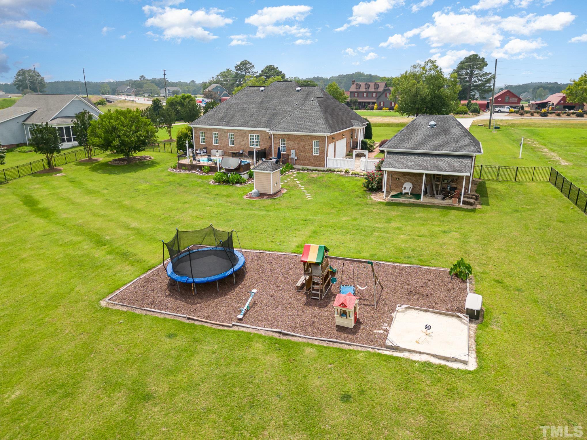3733 Johnson Pond Road Raleigh, NC 27603 - Photo 5 of 41 an aerial view of a house with garden space and swimming pool