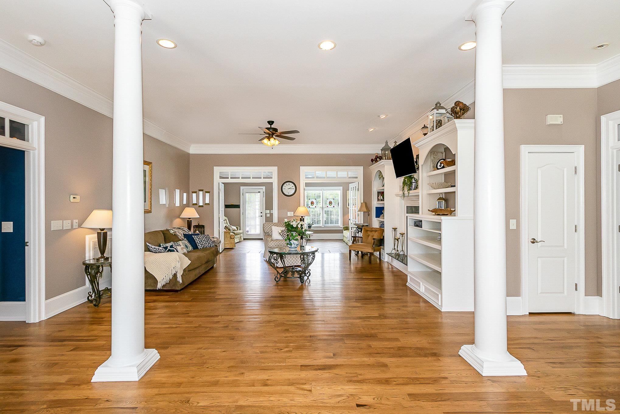 3733 Johnson Pond Road Raleigh, NC 27603 - Photo 8 of 41 a living room with fireplace furniture and wooden floor