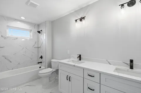 an aerial view of a house with a swimming pool