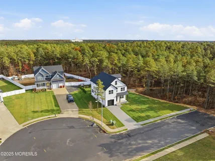 a view of a swimming pool with a yard