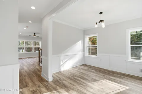 a kitchen with a sink stove top oven and cabinets