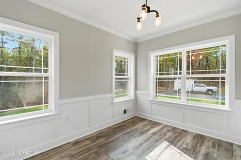 a view of empty room with floor to ceiling window