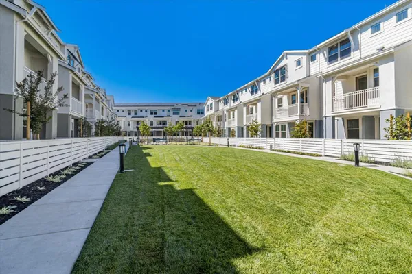 a view of a building with a yard
