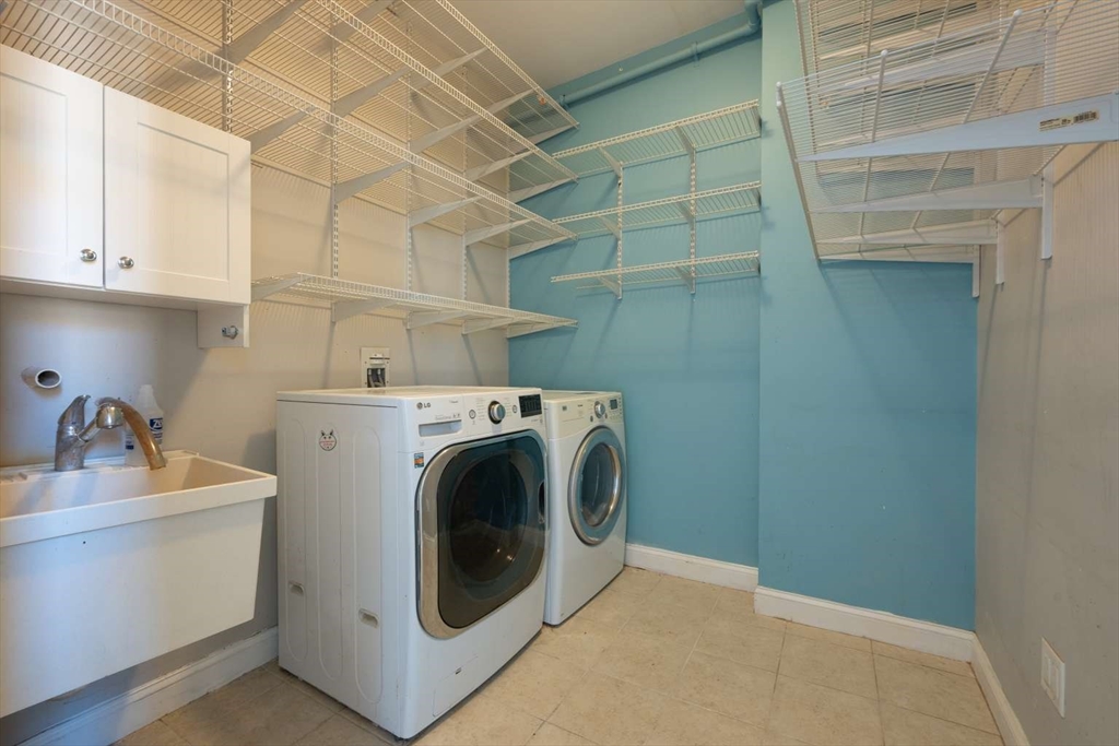 191 Main Street, Unit 3 Gloucester, MA 01930 - Photo 17 of 20 a utility room with dryer and washer