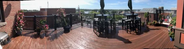 a view of a chairs and table on the wooden deck