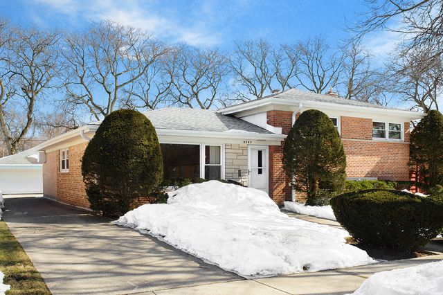 a view of a white house with a yard