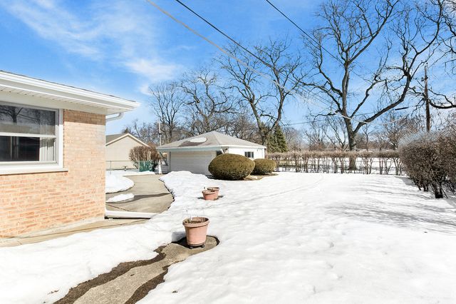 a view of a backyard of snow