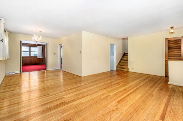 a view of a livingroom with wooden floor