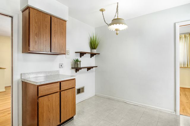 a bathroom with a sink a vanity and a mirror