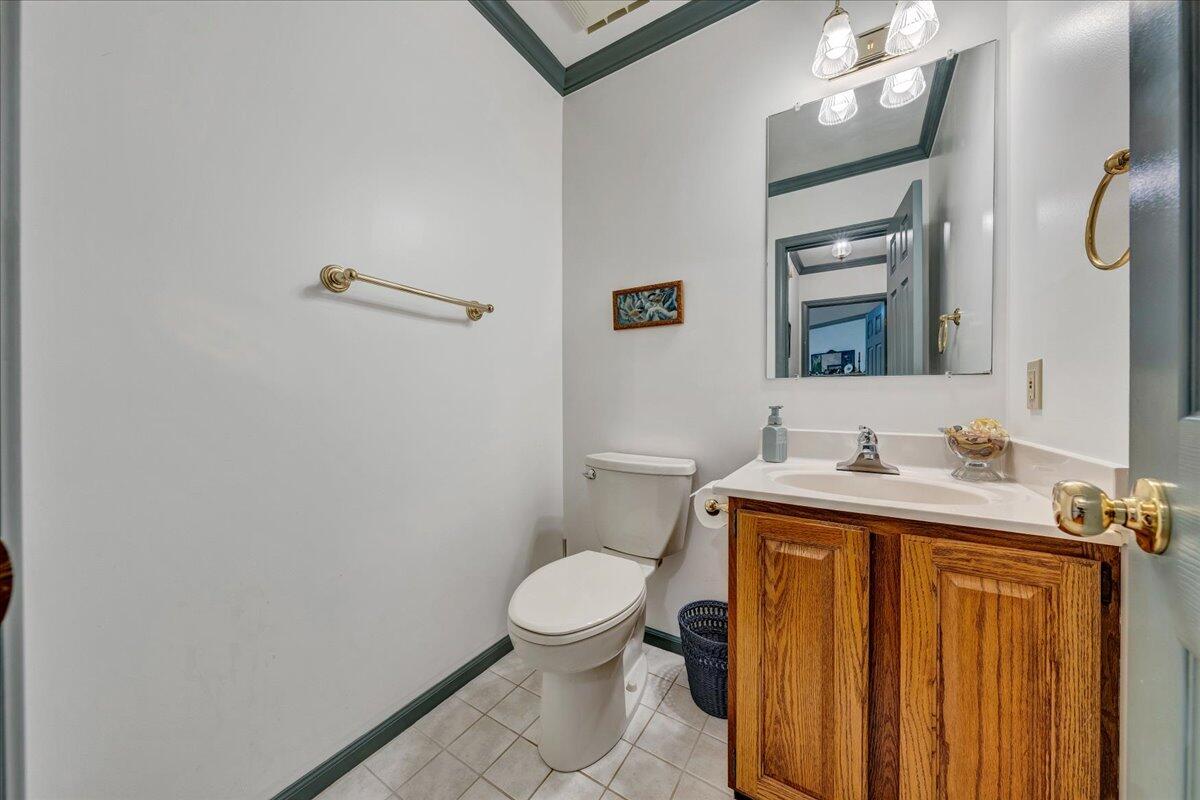 204 Raintree Lane Boones Mill, VA 24065 - Photo 15 of 58 a bathroom with a toilet a sink and mirror
