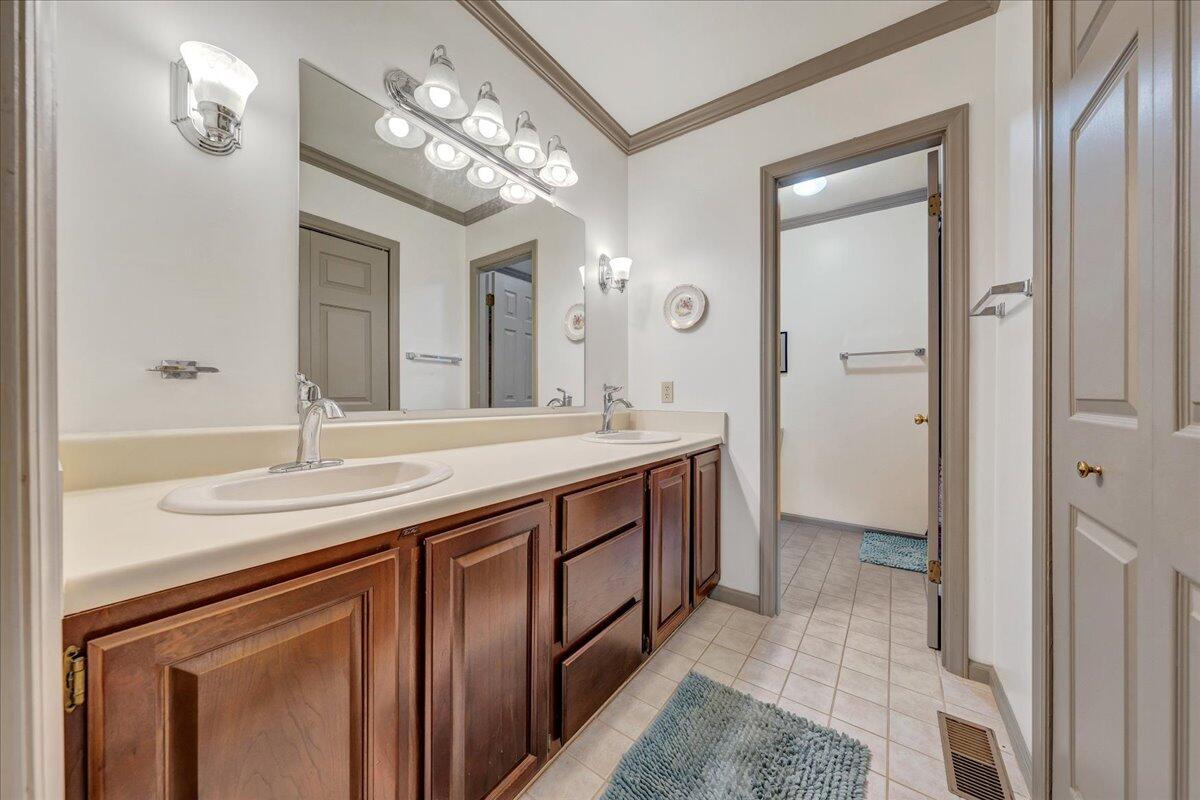 204 Raintree Lane Boones Mill, VA 24065 - Photo 18 of 58 a spacious bathroom with a sink and a mirror