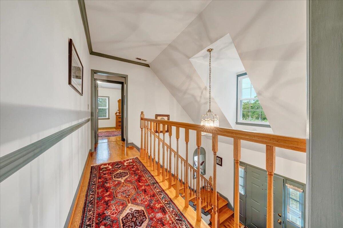 204 Raintree Lane Boones Mill, VA 24065 - Photo 21 of 58 a view of hallway with wooden floor and stairs