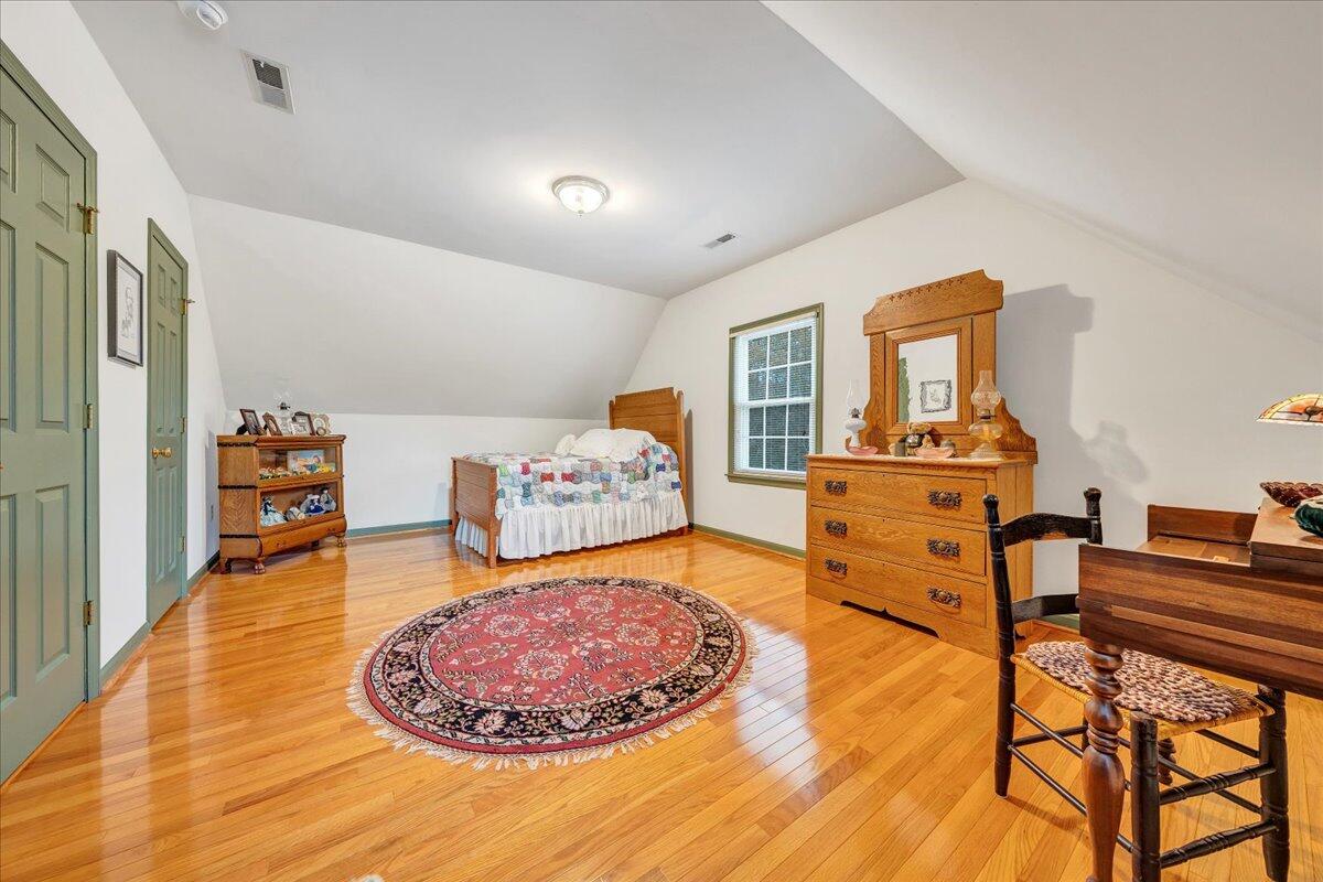 204 Raintree Lane Boones Mill, VA 24065 - Photo 22 of 58 a living room with furniture and a wooden floor