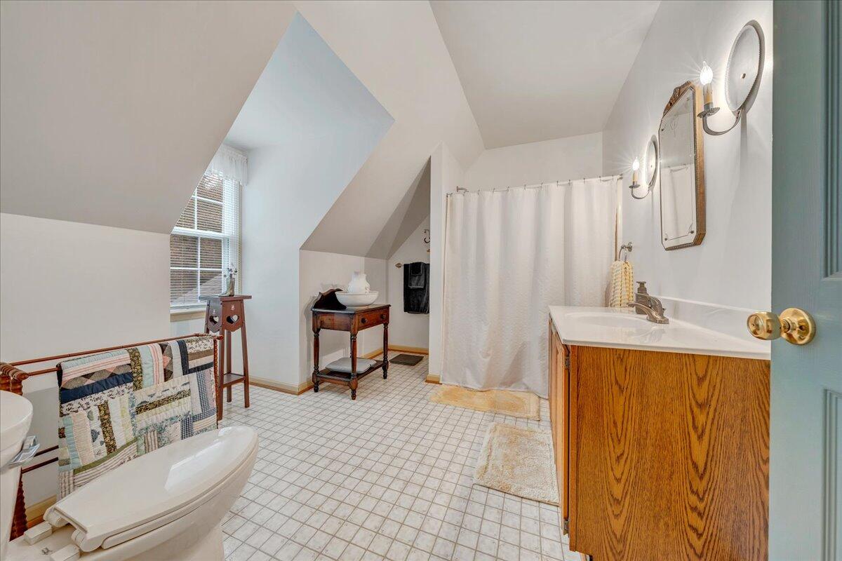 204 Raintree Lane Boones Mill, VA 24065 - Photo 26 of 58 a spacious bathroom with a sink a mirror and a shower