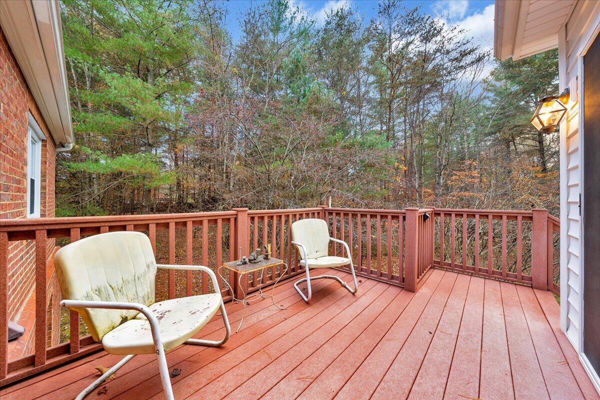 204 Raintree Lane Boones Mill, VA 24065 - Photo 34 of 58 a view of deck with furniture and trees