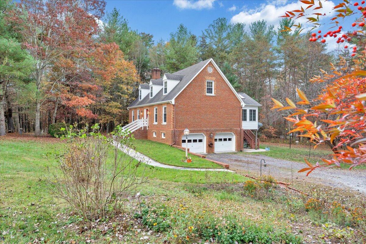 204 Raintree Lane Boones Mill, VA 24065 - Photo 49 of 58 a view of a house with a yard