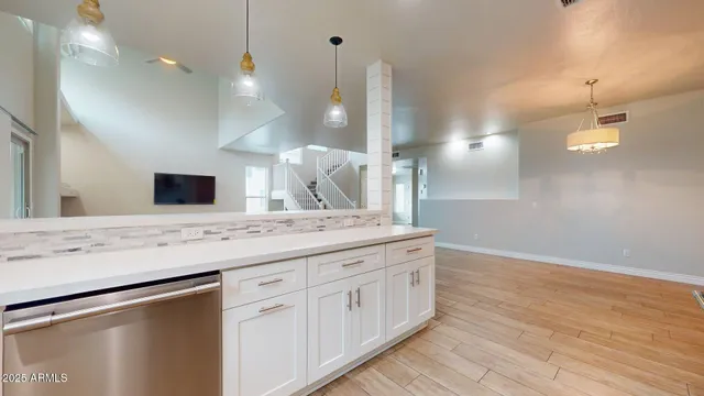 a bathroom with a sink a large mirror and vanity