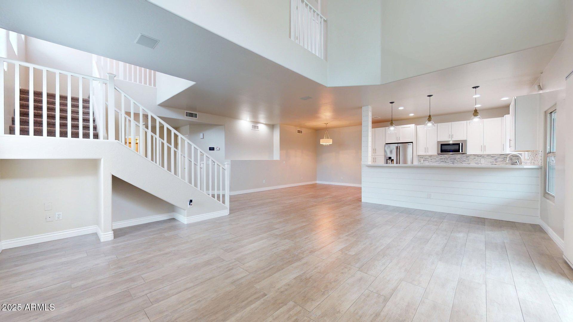 6510 South Hazelton Lane, Unit 142 Tempe, AZ 85283 - Photo 18 of 49 a view of large kitchen with wooden floor and windows