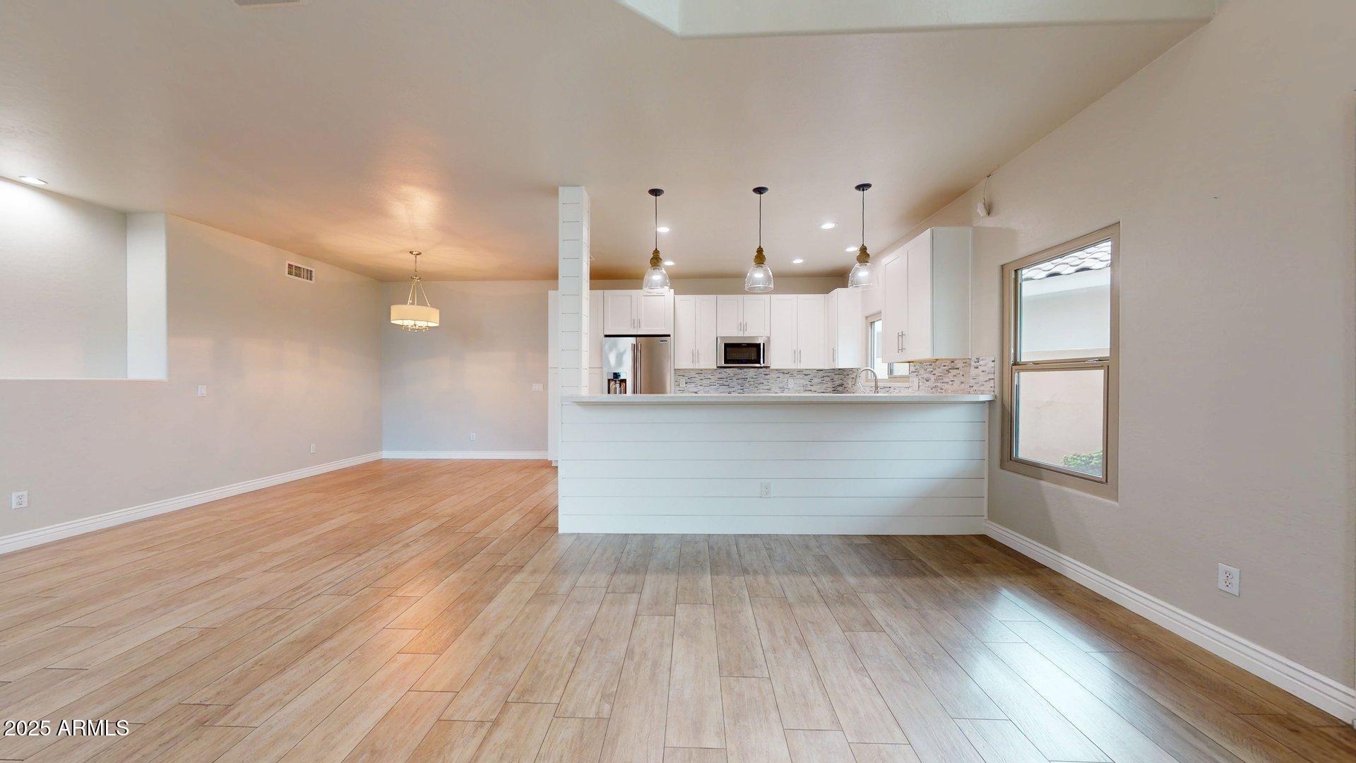 6510 South Hazelton Lane, Unit 142 Tempe, AZ 85283 - Photo 20 of 49 a view of kitchen and wooden floor