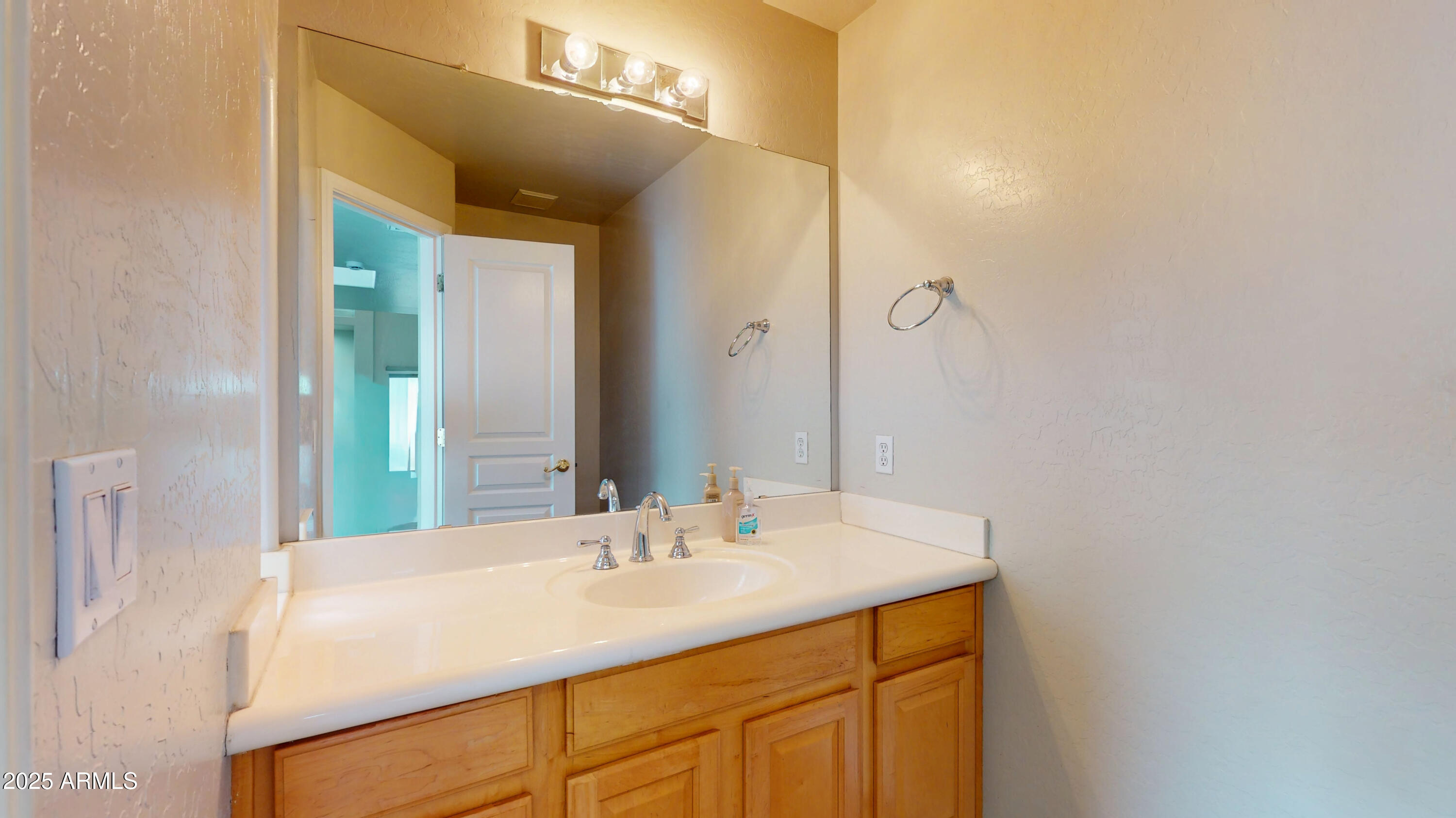 6510 South Hazelton Lane, Unit 142 Tempe, AZ 85283 - Photo 22 of 49 a bathroom with a sink and a mirror