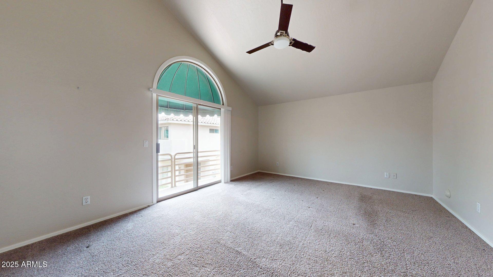 6510 South Hazelton Lane, Unit 142 Tempe, AZ 85283 - Photo 23 of 49 an empty room with windows dryer and chandelier