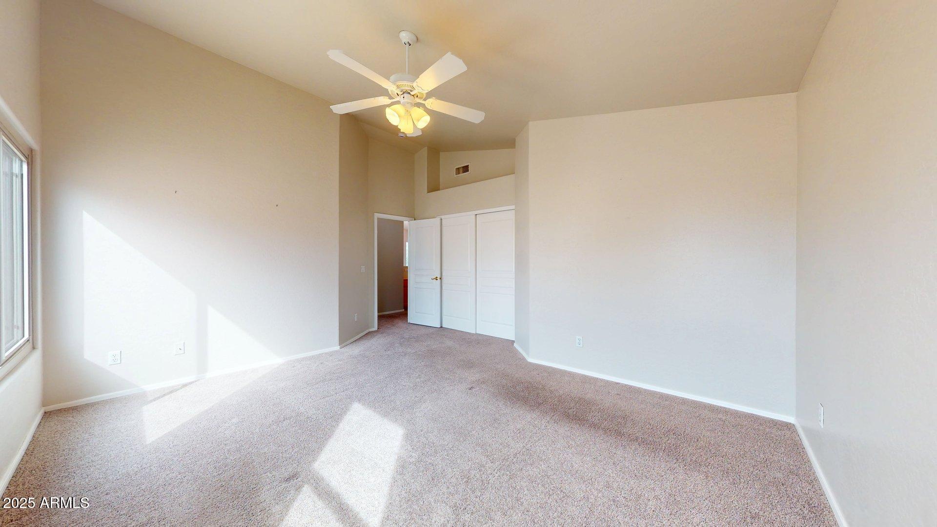 6510 South Hazelton Lane, Unit 142 Tempe, AZ 85283 - Photo 37 of 49 a view of a bedroom with a hallway