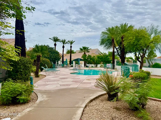 a view of a swimming pool with a patio