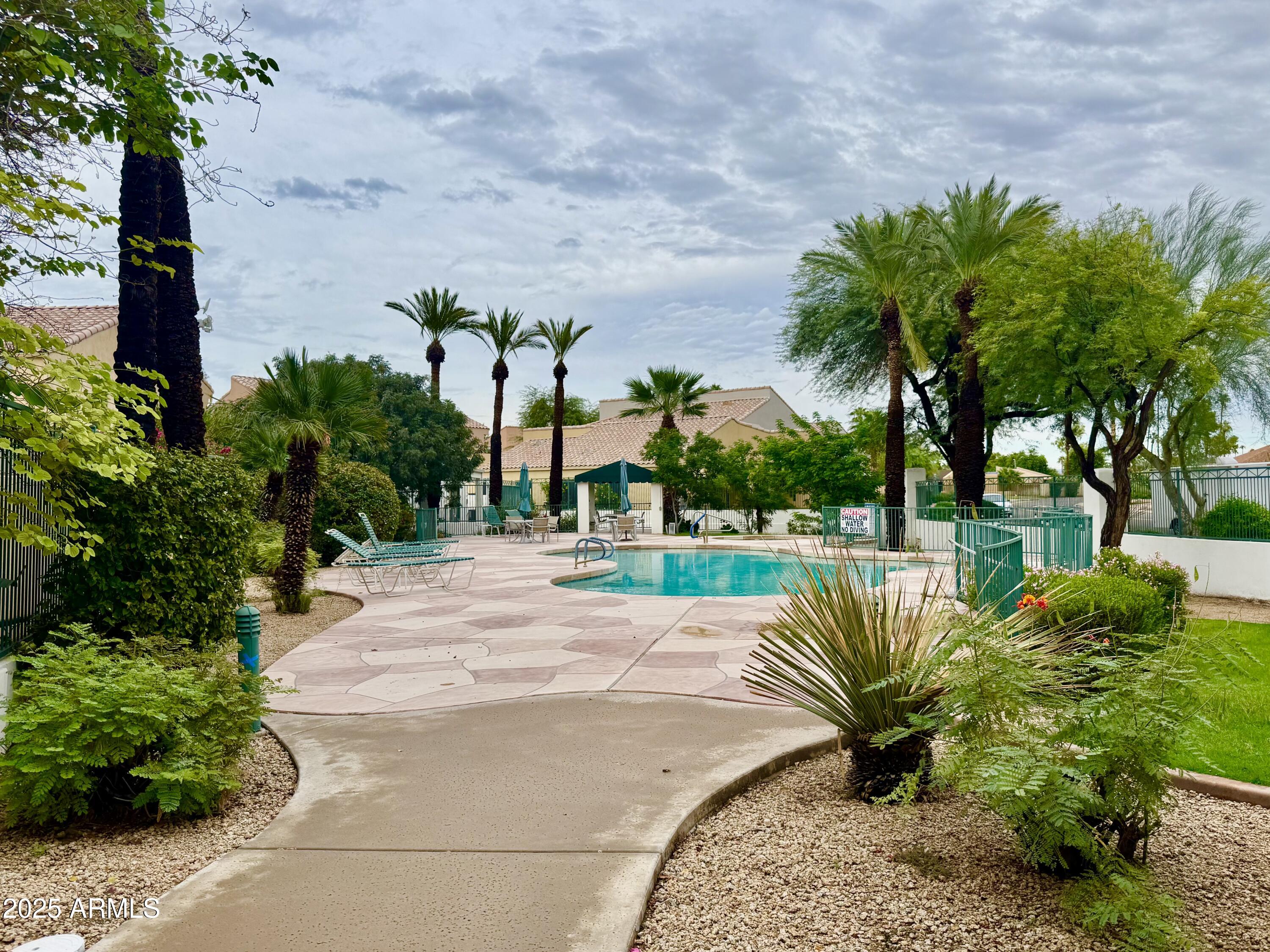 6510 South Hazelton Lane, Unit 142 Tempe, AZ 85283 - Photo 45 of 49 a view of a swimming pool with a patio