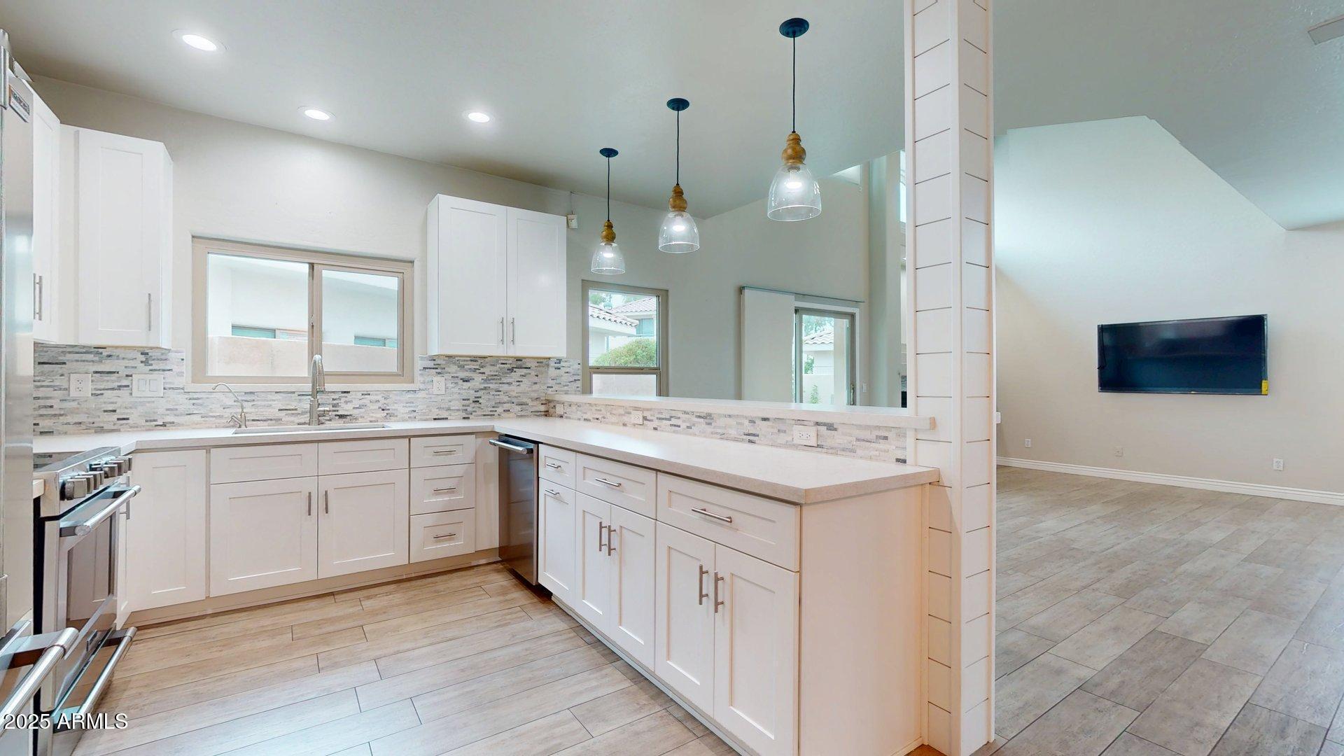 6510 South Hazelton Lane, Unit 142 Tempe, AZ 85283 - Photo 8 of 49 a large bathroom with a sink and a large mirror
