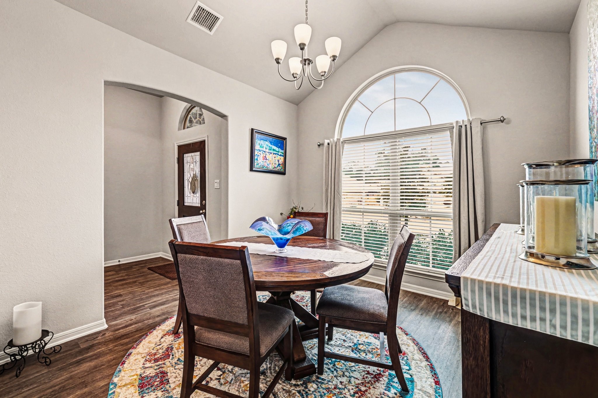 320 Red Maple Lane Conroe, TX 77304 - Photo 5 of 24 Light-filled dining space with vaulted ceiling and arched window.