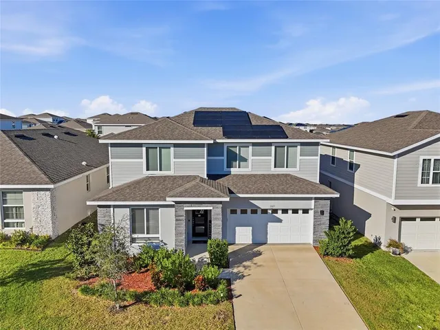 front view of a house with a yard