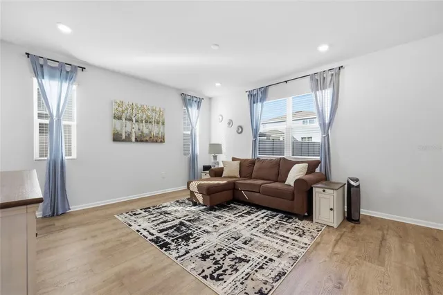 a living room with furniture and a window