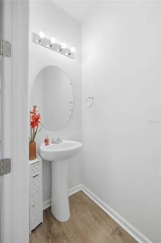 a bathroom with a sink and mirror