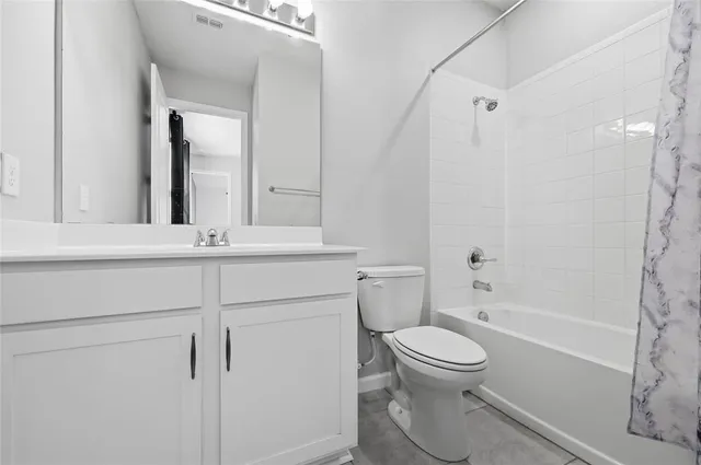 a bathroom with a toilet sink and a bathtub