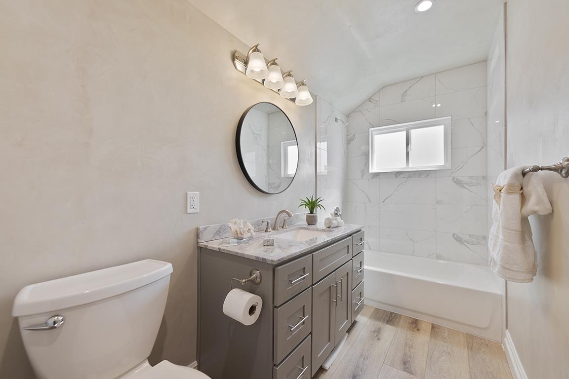 Cero Drive Santa Clarita, CA 91350 - Photo 12 of 45 a bathroom with a sink a toilet and a mirror