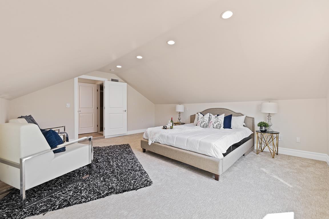 Cero Drive Santa Clarita, CA 91350 - Photo 18 of 45 a spacious bedroom with a bed and a couch