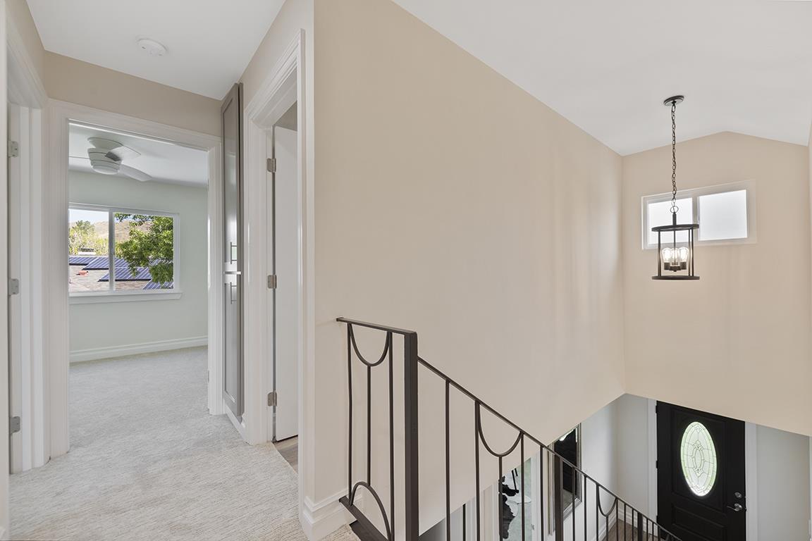 Cero Drive Santa Clarita, CA 91350 - Photo 19 of 45 a view of a hallway with wooden floor and stairs