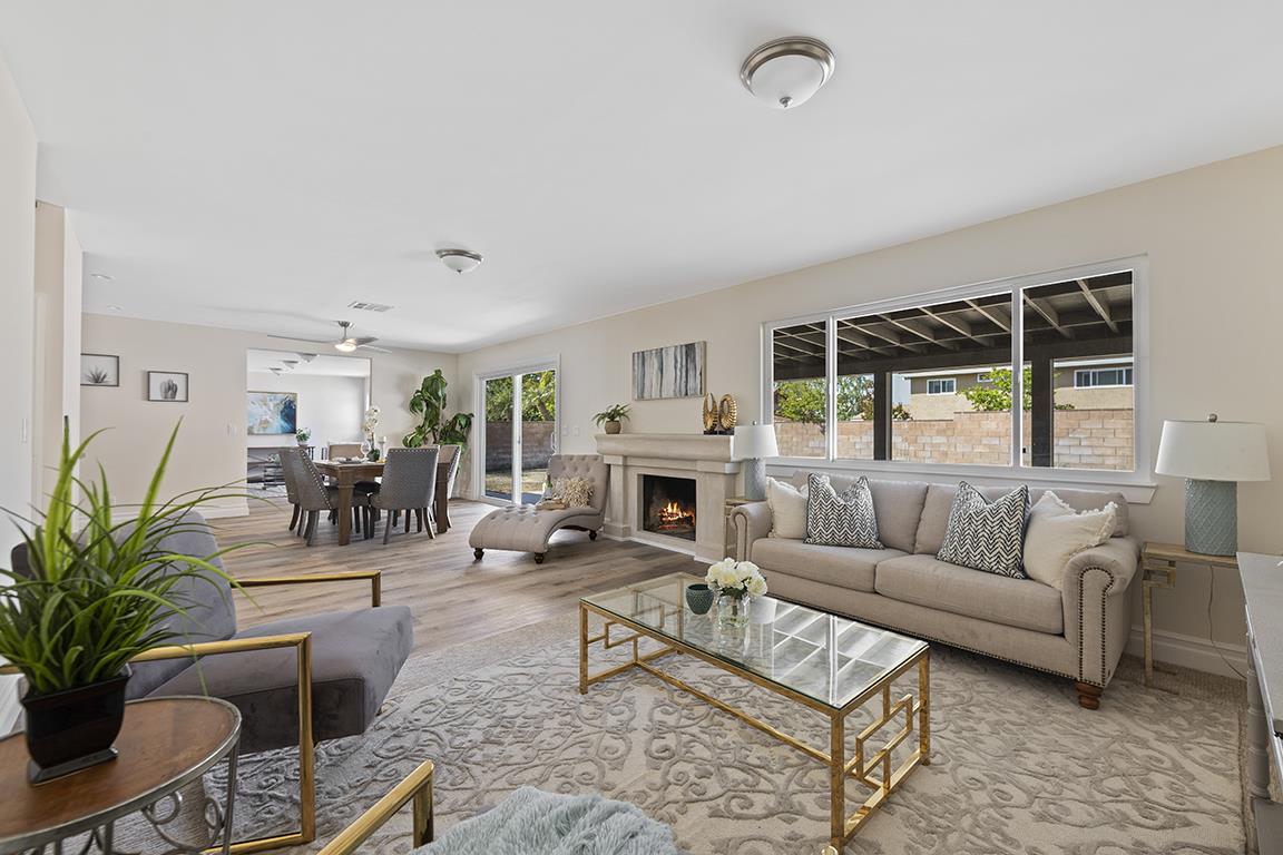 Cero Drive Santa Clarita, CA 91350 - Photo 23 of 45 a living room with furniture a fireplace and a flat screen tv