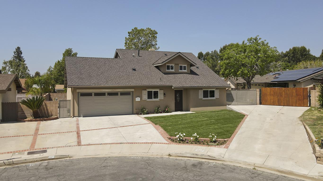 Cero Drive Santa Clarita, CA 91350 - Photo 3 of 45 a front view of a house with garden